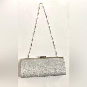 Silver glitter gemmed purse with chain strap.